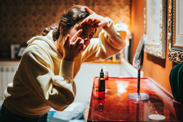 woman putting in or removing a contact lens