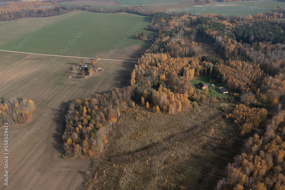 Aufkleber an aerial view of a farm surrounded by trees and fields with a house in the middle of the picture, s