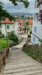 Stairs in a city, Swiss city, stairs leading into a city, stairs leading into a Swiss city, stairs leading into a town, Stairs in a town, stairs leading into a village, stairs in a village