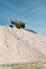 Trucks unloading raw salt bulk, Salinas Grandes de Hidalgo, La Pampa, Argentina.
