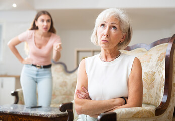 Offended mature mom and adult daughter avoid talking