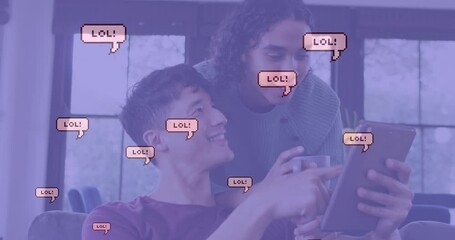 Animation of lol text in speech bubbles over diverse male couple using tablet - Powered by Adobe