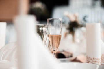 Beautiful wedding room with wedding table with food, flowers and drinks, decorations,lights everywhere