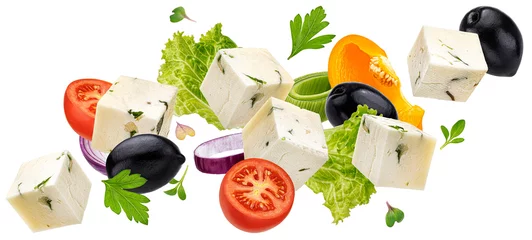 Ingelijste posters Falling greek salad ingredients isolated on white background, mediterranean food concept © xamtiw