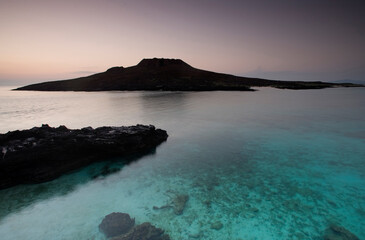 The azure waters that surround Sombrero Chino, just off the coast of Santiago Island are a reminder that despite all its difficu