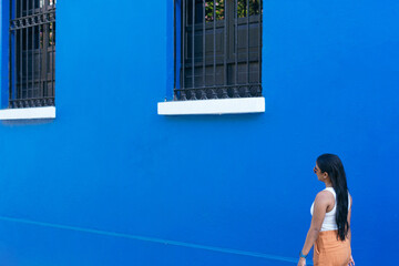 Woman walking through the streets of Cartagena, Colombia