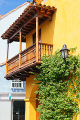 Fototapeta na wymiar Street With Lamppost And Climbing Plants In Cartagena De Indias, Colombia