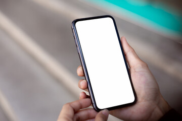 cell phone blank white screen mockup.hand holding texting using mobile on desk at office.background empty space for advertise.work people contact marketing business,technology
