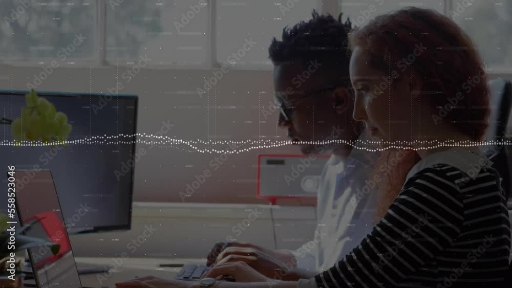 Poster animation of graphs and changing numbers over multiracial coworkers working on laptop in office