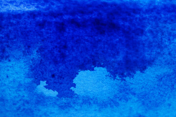 Abstract blue watercolor painting as background, top view