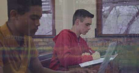 Animation of binary codes, trading board over diverse male students writing in book at classroom - Powered by Adobe