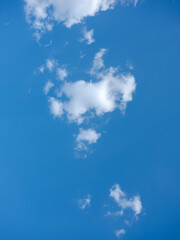 Fototapeta na wymiar blue sky and puffy clouds
