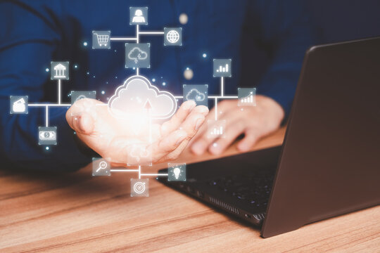 Businessman working at cloud data icon, cloud computing diagram show on hand. Cloud technology. Data storage. Networking and internet service concept.