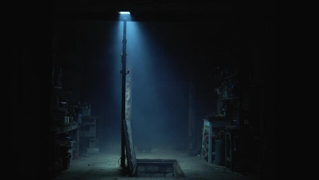 Old garage with blue light. Atmosphere dark place full of smoke. Strang and mystery man in black coat and black hat is walking 