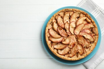 Delicious apple pie on white wooden table, top view. Space for text