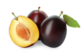 Whole and cut ripe plums on white background