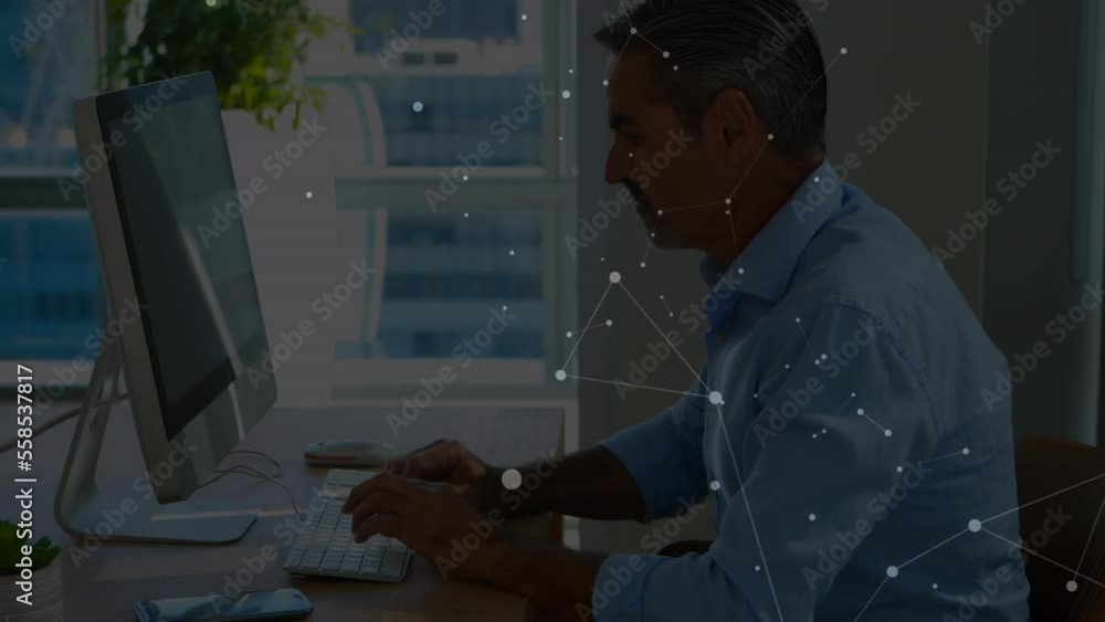 Aufkleber animation of connected dots on caucasian man talking on cellphone and working on compute