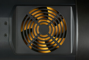close-up of cooling fan with yellow plastic blades, cooling computers and other electronic...