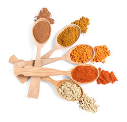Wooden spoons with different spices on white background, top view