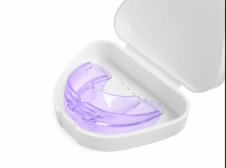 Container with transparent dental mouth guard isolated on white. Bite correction