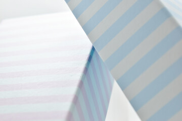Fototapeta premium closeup striped pink and blue paper box, package for design