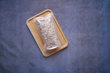 top view of granola Musli in a plastic packet on table 