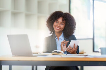 Financial advisor, corporate accountant and african woman in office. analyzing benefits, enjoying financial success, job high result