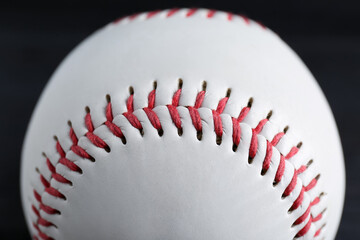 Baseball ball on black background, closeup. Sports game
