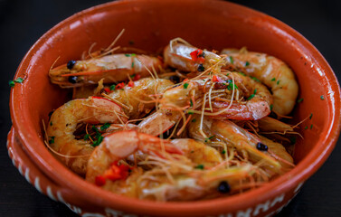 Grilled shrimp, Portuguese style with crushed chili peppers, garlic and parsley at an al fresco restaurant in Porto
