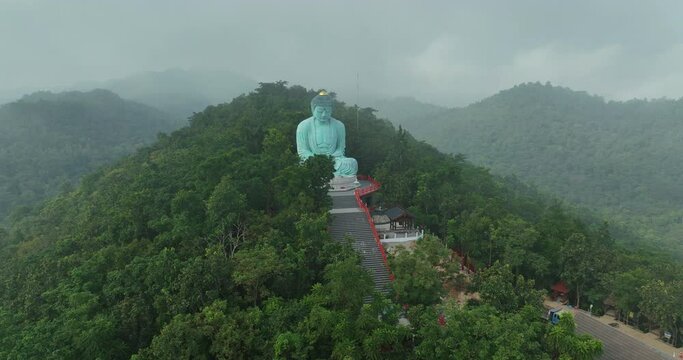 Aerial View at Morning Wat Phra That Doi Phra Chan. and Daibutsu Buddha on the mountain at Lampang Province Thailand 4k video from Drone.