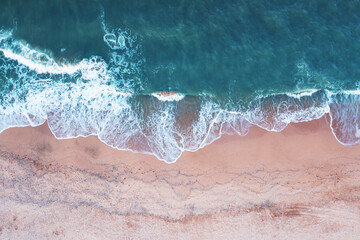 Fototapeta premium Beach view from a drone. A wonderful summer landscape, clean sand and blue water.
