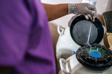 Close up hand of researcher testing in a laboratory. Modern technologies in agriculture management, agribusiness and research concept.