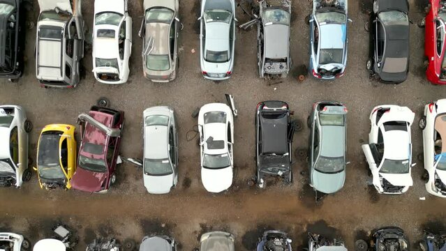 Aerial overhead shot broken cars at a junk yard