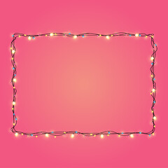 Christmas lights string rectangle shape on pink background.