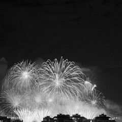 NITERÓI, RIO DE JANEIRO, BRAZIL – 01/01/2023: Night photo of the arrival of the New Year (Réveillon) in black and white with fireworks in the sky of a Brazilian city