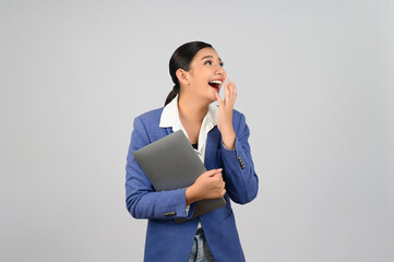 Young beautiful woman in formal clothing for officer holding laptop computer