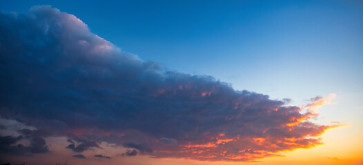 Clouds at sunset. Blue and orange. A wonderful natural background.