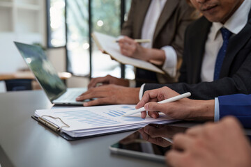 Financial analyst analyzes business people investment consultant analyzing company financial report working with documents graphs. Stock Market Tax Fund Finance concept