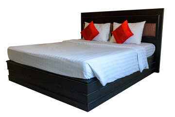 Wooden bed with bedding
