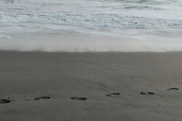 sand on natural beach with footprints for background