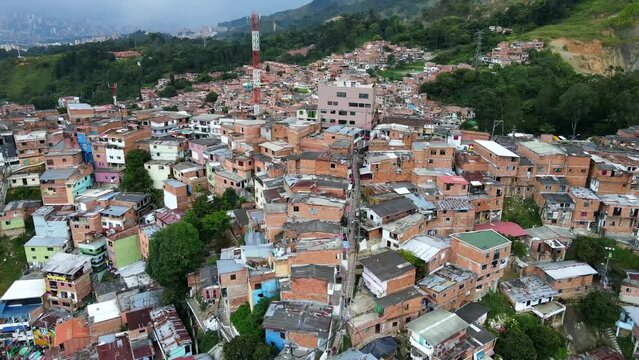 Aerial shot drone descends on long stairway in comuna 13 shanty town