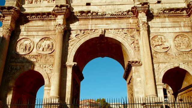 The Arch of Constantine at sunset in Rome, Italy. Built in 315 AD by Emperor Constantine, the arch stands tall, bathed in golden light