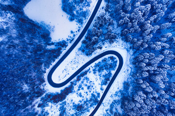 Winter road in the mountains drone view