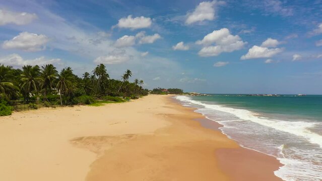 Aerial Seascape with tropical sandy beach and blue ocean. Lankavatara, Sri Lanka.