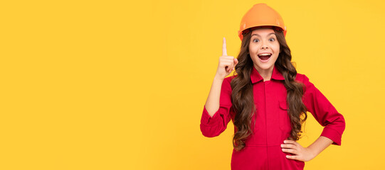 happy kid girl in protective helmet raised finger with idea, inspiration. Child builder in helmet horizontal poster design. Banner header, copy space.