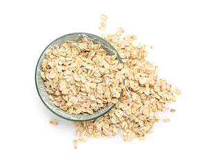 Bowl of raw oat flakes on white background