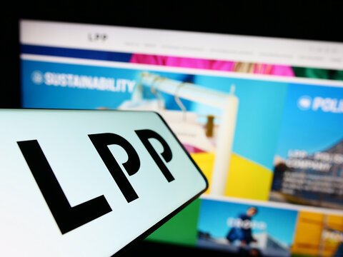 Stuttgart, Germany - 12-25-2022: Cellphone with logo of Polish clothing retail company LPP SA on screen in front of business website. Focus on center-left of phone display.