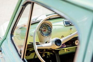 Steering wheel of an old car, retro auto at an open air exhibition