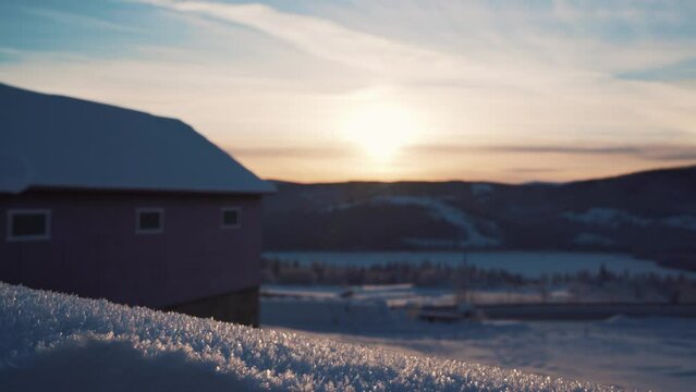 Shot of sledding on cold Christmas day with thick layer of snow in Beitostolen, village in Oystre Slidre Municipality in Innlandet county,Valdres, Beito, Norway with sunset in background.