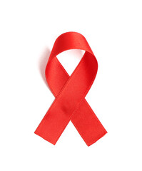 Red satin ribbon on white background. AIDS awareness concept